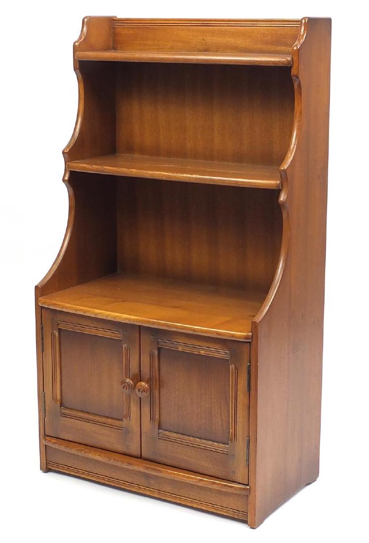 Ercol waterfall bookcase with cupboard door base, 111cm H x 61cm W x 33cm D: Ercol waterfall bookcase with cupboard door base, 111cm H x 61cm W x 33cm D