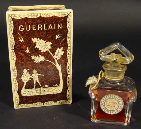 Baccarat Guerlain glass scent bottle and stopper w: Baccarat Guerlain glass scent bottle and stopper with original paper label 'L'Heure Bleue' housed in a Guerlain box, etched mark to the base, 12cm high