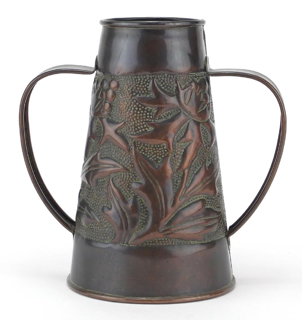 Irish Arts & Crafts copper vase with twin handles by: Irish Arts & Crafts copper vase with twin handles by John Williams, embossed with flowers, 19cm high