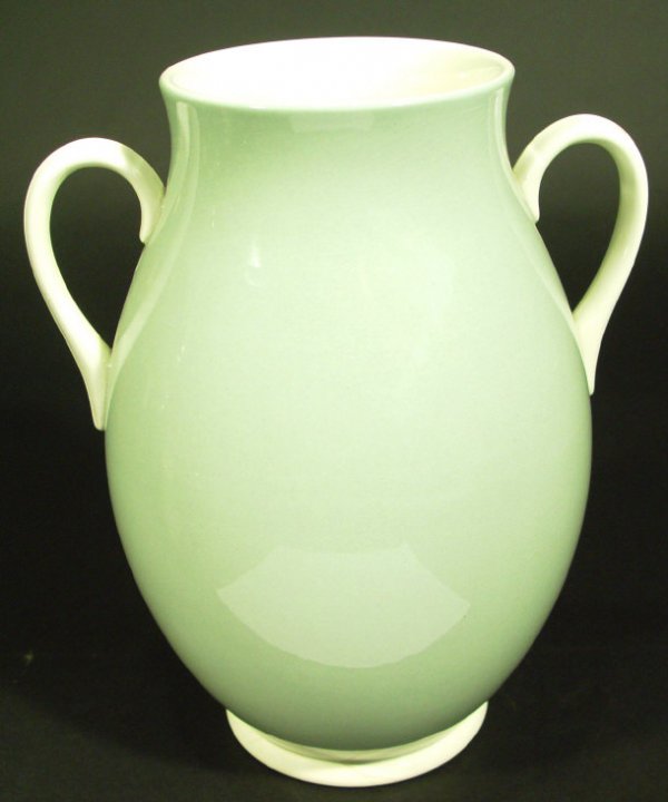 Wedwood Keith Murray two handled vase decorated wi: Wedwood Keith Murray two handled vase decorated with a green and white glaze, printed factory mark and full signature to the base, 26cm high