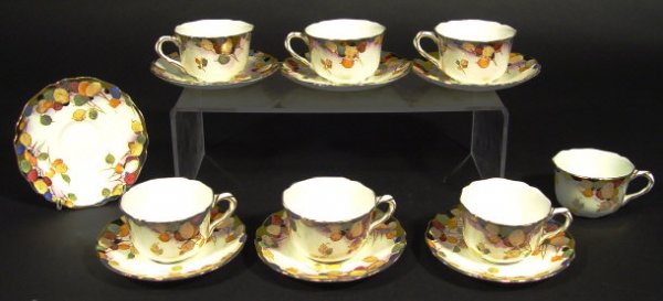 Seven Royal Doulton cups and saucers, each hand c