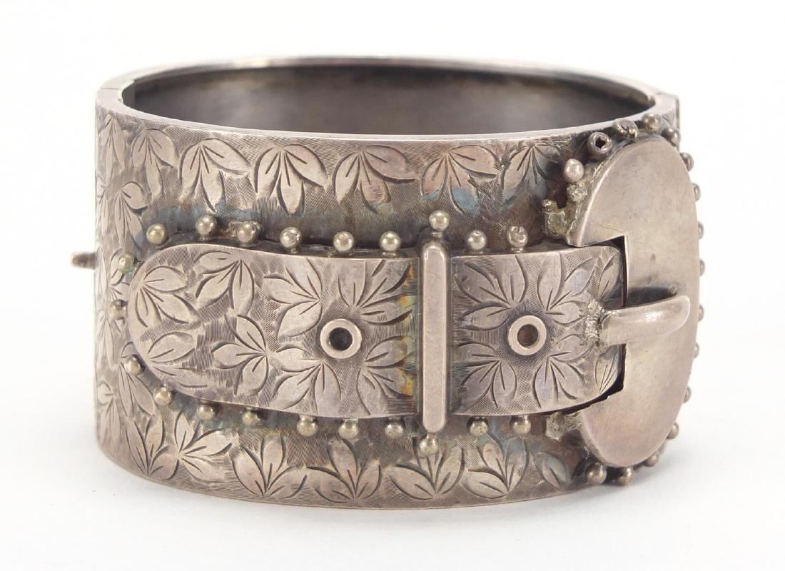 Large Victorian silver buckle bracelet, with floral: Large Victorian silver buckle bracelet, with floral chased decoration, Birmingham 1883, housed in a tooled leather silk lined box, approximate weight 50.5g