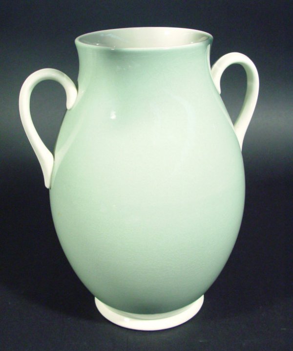 Wedgwood Keith Murray two handled vase decorated: Wedgwood Keith Murray two handled vase decorated with a green and white glaze, printed factory mark and full signature to the base, 26cm high