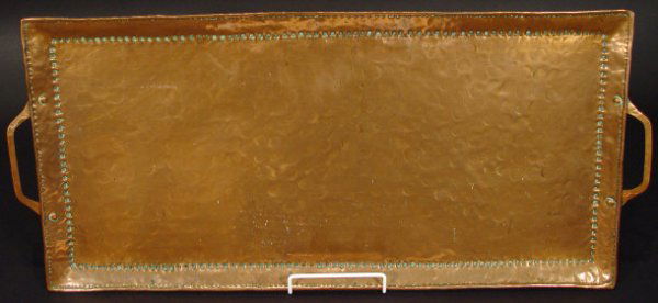 Rectangular John Pearson two handled copper tray w: Rectangular John Pearson two handled copper tray with hammered decoration, impressed initials to the back, 64cm in length