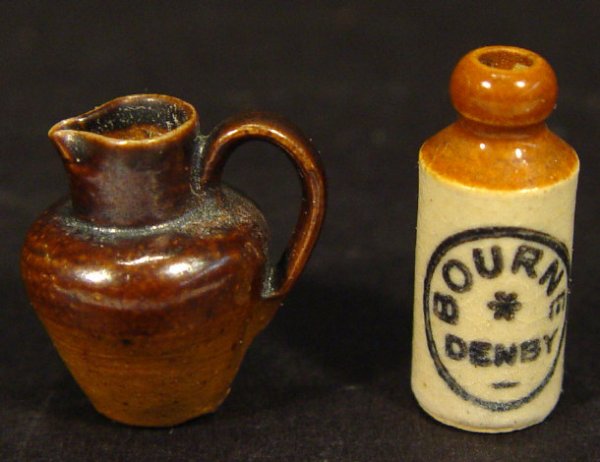Bourne Denby miniature stoneware advertising bottl: Bourne Denby miniature stoneware advertising bottle and a miniature stoneware jug, each 1cm high