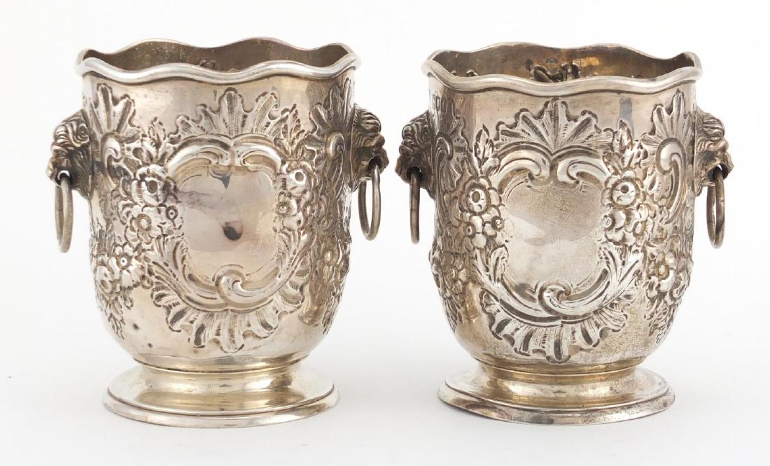 Pair of Victorian silver miniature ice buckets,: Pair of Victorian silver miniature ice buckets, embossed with flowers and lion mask ring handles, by Charles Stuart Harris London 1899, 10cm high, approximate weight 270.0g