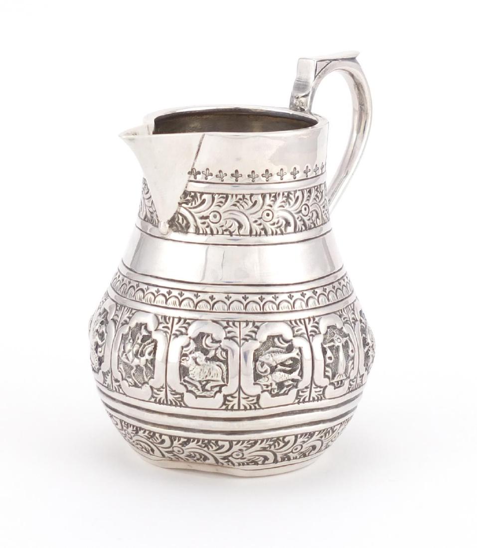 Victorian silver sparrow beak jug, embossed with zodiac: Victorian silver sparrow beak jug, embossed with zodiac symbols, by Charles Stuart Harris, London 1884, 9.5cm high, approximate weight 95.0g