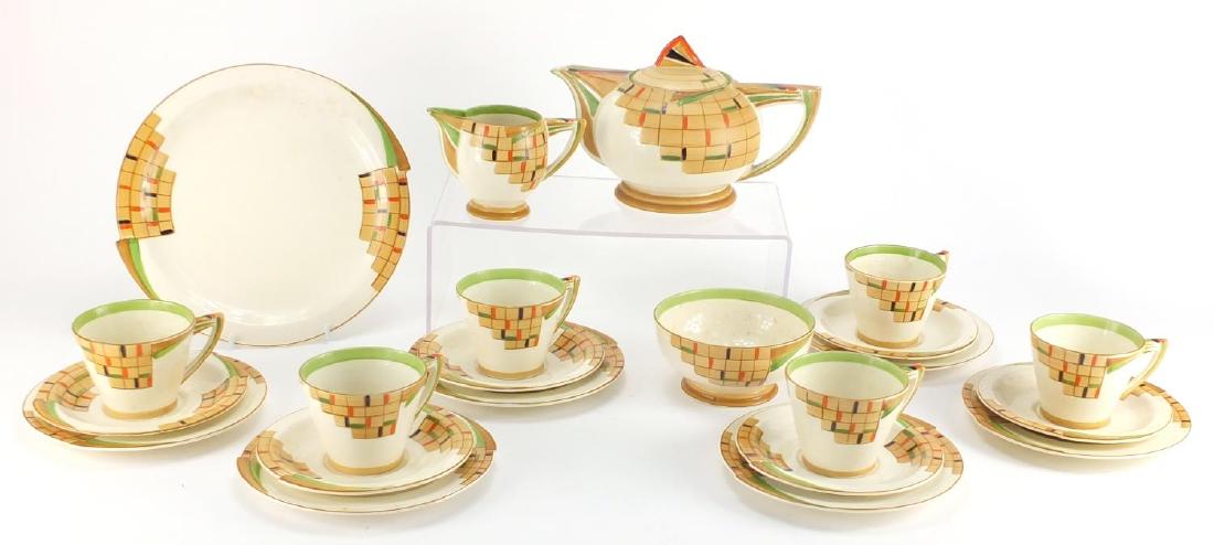 Art Deco six place tea service by Royal Venton Ware,: Art Deco six place tea service by Royal Venton Ware, hand painted with stylised geometric motifs comprising a teapot, milk jug, sugar bowl, six trio's and a sandwich plate, the teapot 14.5cm high