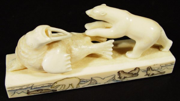 Inuit ivory carving of a polar bear attacking a wa