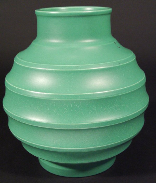 Wedgwood Keith Murray green glazed football vase,: Wedgwood Keith Murray green glazed football vase, impressed factory mark and full signature to the base, 23cm high