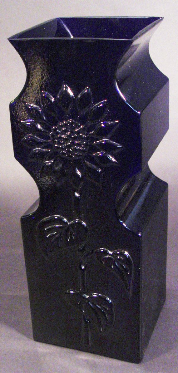 Large Dartington blue glass vase moulded in relief: Large Dartington blue glass vase moulded in relief with a sunflower, design attributed to Frank Thrower, 39cm high