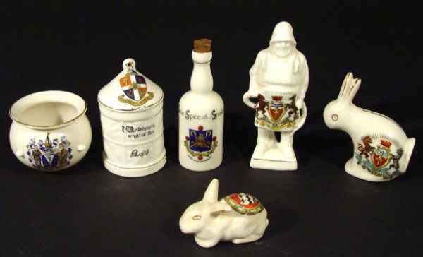 Six crested china items including an Arcadian rabb: Six crested china items including an Arcadian rabbit with Bath crest, Arcadian watchman's lantern with Luton crest, an Arcadian Special Scotch bottle with arms of Glastonbury crest etc, the largest 11