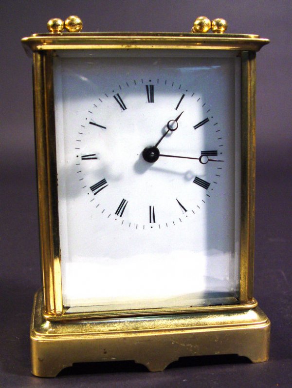 Brass cased carriage clock with bevel edged glass