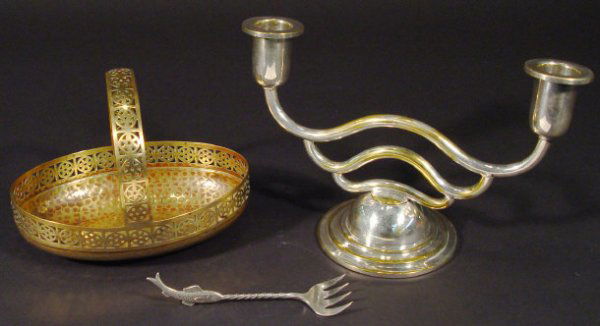 WMF silver plated two branch candelabra, a WMF ov: WMF silver plated two branch candelabra, a WMF oval basket with pierced decoration and a WMF fish fork, each item with impressed factory marks, the largest 17cm high