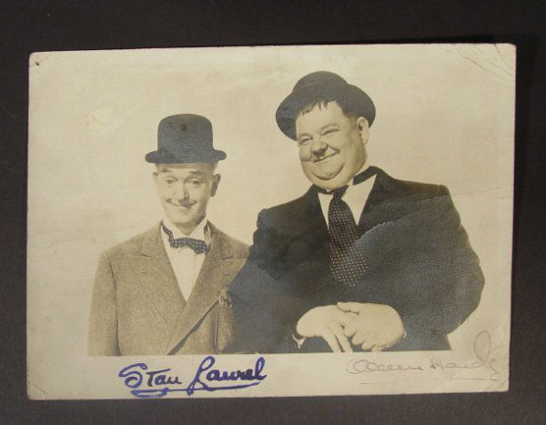 Autographed Laurel and Hardy black and white photo: Autographed Laurel and Hardy black and white photograph, signed in blue and black ink, 13cm x 18cm