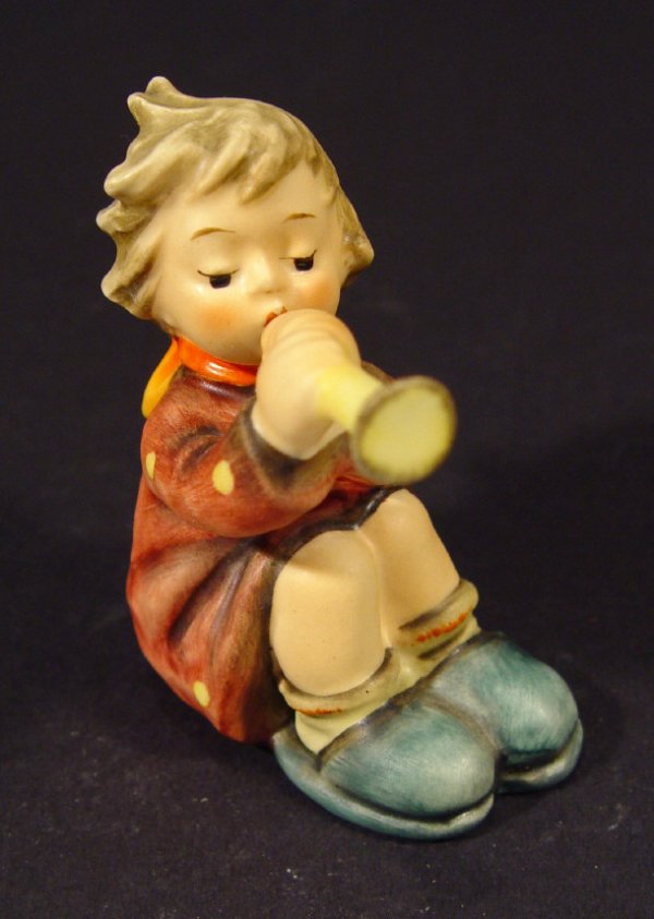 hummel boy playing flute