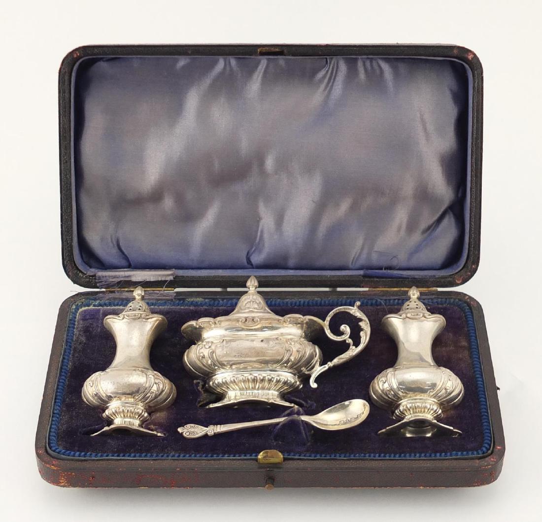 Victorian silver three piece cruet, by Barker Brothers: Victorian silver three piece cruet, by Barker Brothers Birmingham 1899, the largest 9.5cm high, approximate weight 205.0g, housed in a velvet and silk lined tooled leather fitted box