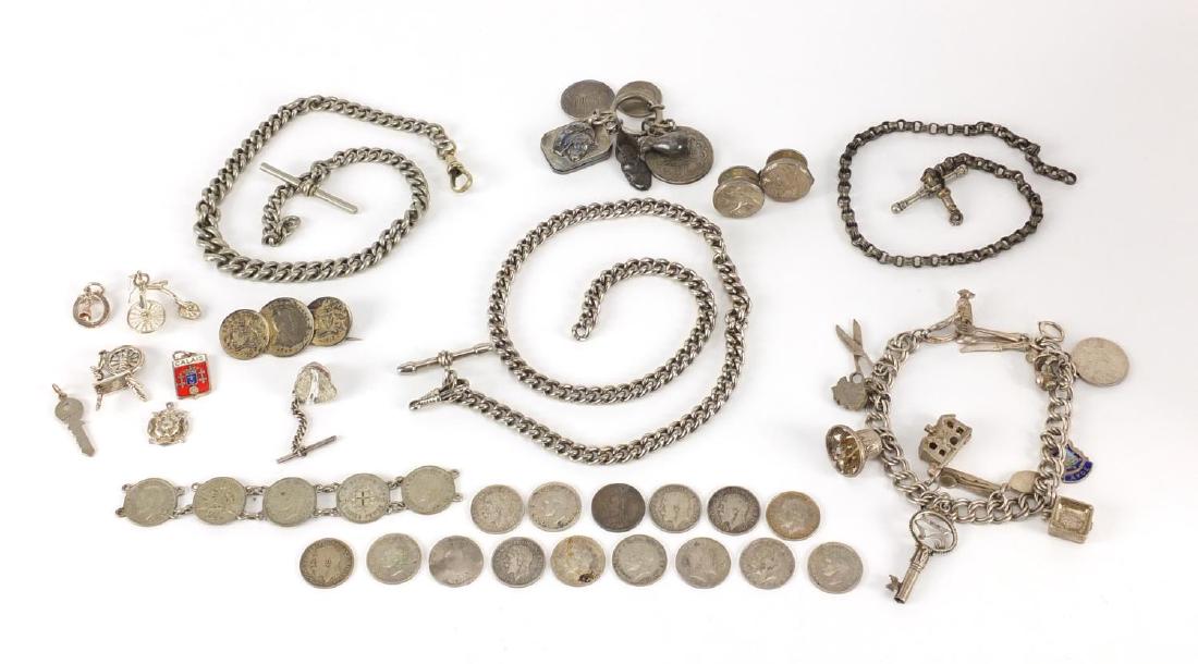 Silver and white metal jewellery including charm: Silver and white metal jewellery including charm bracelets, watch chains and coins, approximate weight 204.0g