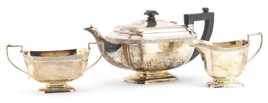 Silver three piece tea set, by John Taylor & Co,: Silver three piece tea set, by John Taylor & Co, Birmingham 1938, the teapot 30cm in length, approximate weight 1222.0g