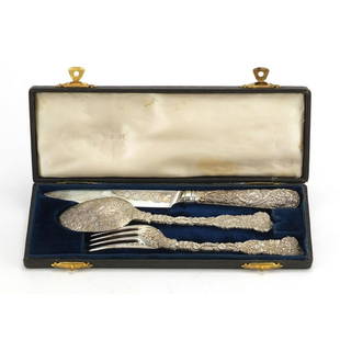 Good 19th century silver knife, fork and spoon: Good 19th century silver knife, fork and spoon Christening set, with fruiting vines, by William Traies London 1837, housed in a fitted tooled leather box, the knife 21.5cm in length, approximate weigh