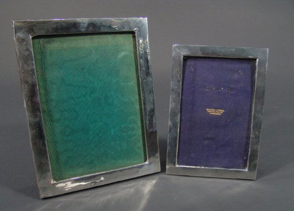 Two rectangular silver easel photo frames, the sma: Two rectangular silver easel photo frames, the smaller with engine turned decoration, both with Birmingham hallmarks, the larger 25cm x 20cm
