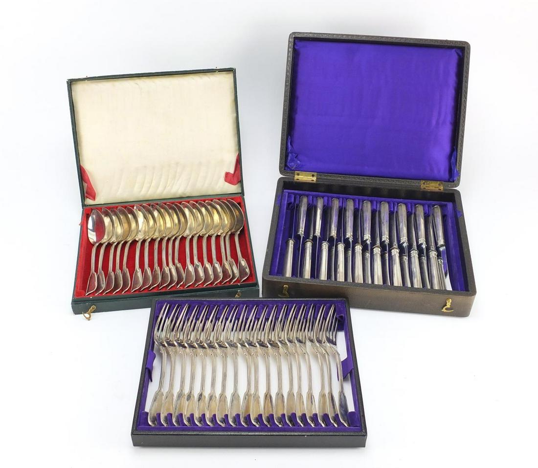 Set of eighteen German silver knives, forks and spoons,: Set of eighteen German silver knives, forks and spoons, all housed in a velvet and silk lined tooled leather boxes, the blades impressed Grieshaber, the forks 662.0g, each 18cm in length, the knives 1