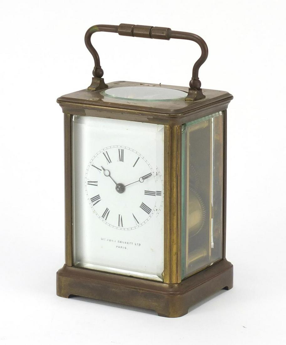 Large brass cased carriage clock striking on a gong,: Large brass cased carriage clock striking on a gong, enamelled dial with Roman numerals inscribed Sit John Bennett, Paris, 13.5cm high