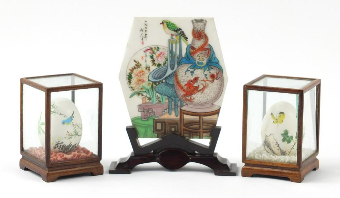 Chinese miniature stone table screen hand painted with: Chinese miniature stone table screen hand painted with a bird and vessels together with two egg shell eggs, the largest 16cm high