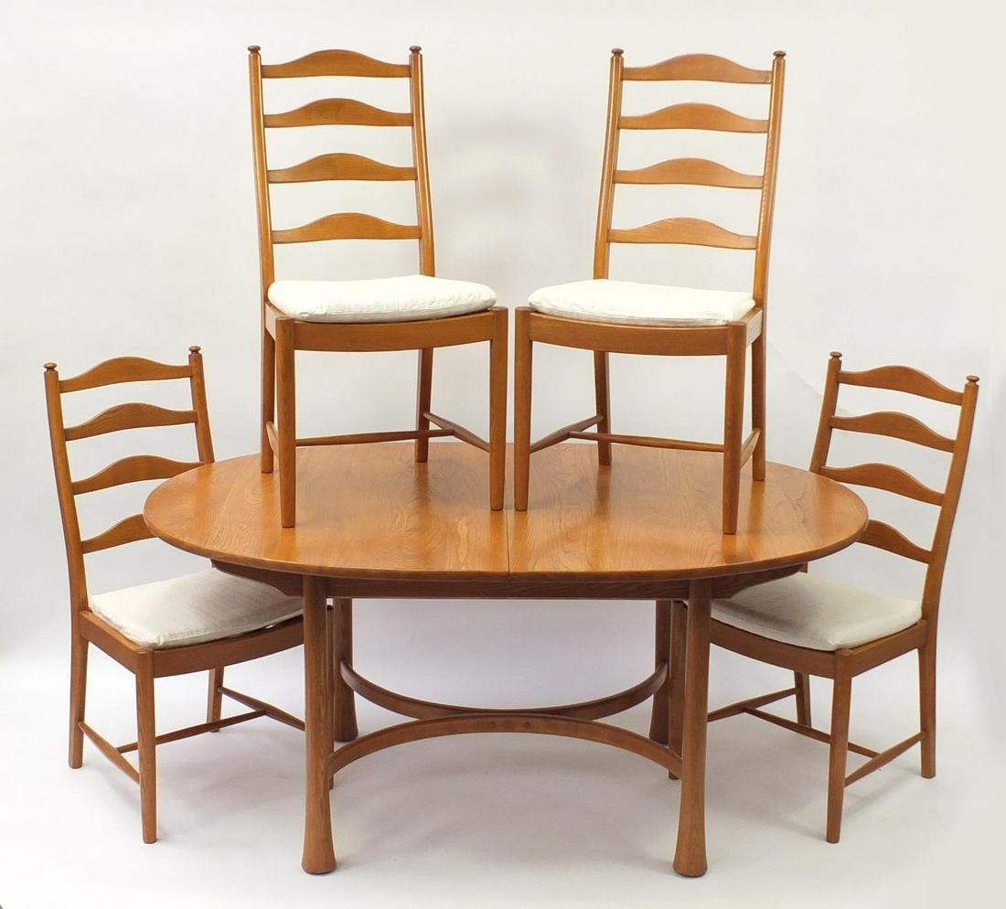Ercol elm oval extending dining table with four chairs,: Ercol elm oval extending dining table with four chairs, the table 94.5cm H x 163cm W x 107.5cm D