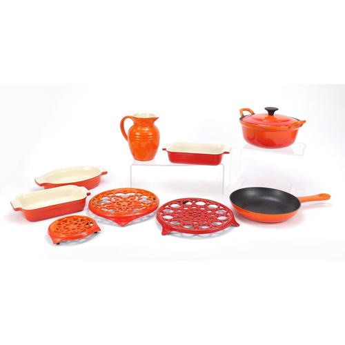 Le Creuset kitchenalia including casserole dishes,: Le Creuset kitchenalia including casserole dishes, trivets and a lidded tureen