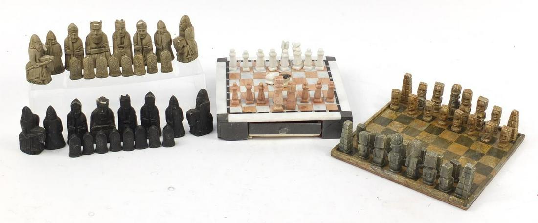 Two carved stone chess sets with boards and one other: Two carved stone chess sets with boards and one other chess set, the largest piece 9cm high
