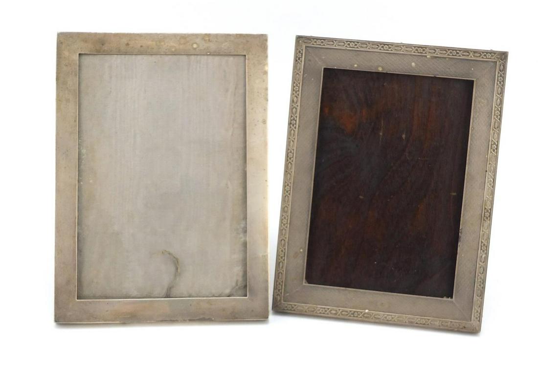 Two rectangular silver easel photo frames, one with: Two rectangular silver easel photo frames, one with engine turned decoration, hallmarked Birmingham 1916 and 1927, each 21cm x 15.5cm
