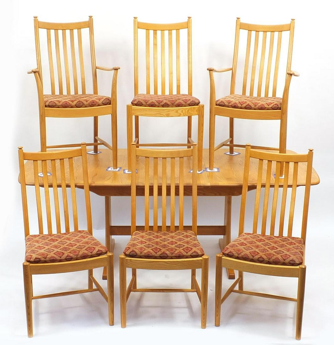 Ercol light elm extending dining table with extra leaf: Ercol light elm extending dining table with extra leaf and six chairs including two carvers, the table 75cm H x 150cm W x 90cm D