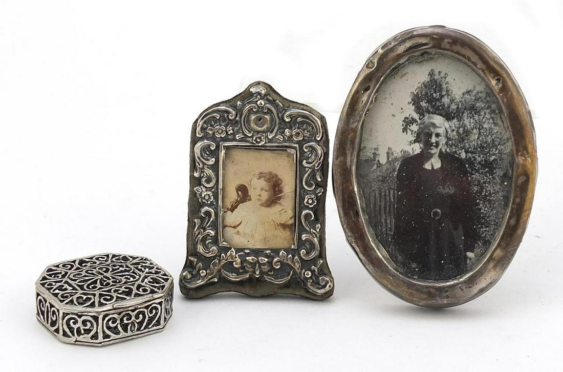 Two Victorian and later silver miniature photo frames: Two Victorian and later silver miniature photo frames and pierced silver jewel box, various hallmarks, the largest 7cm high