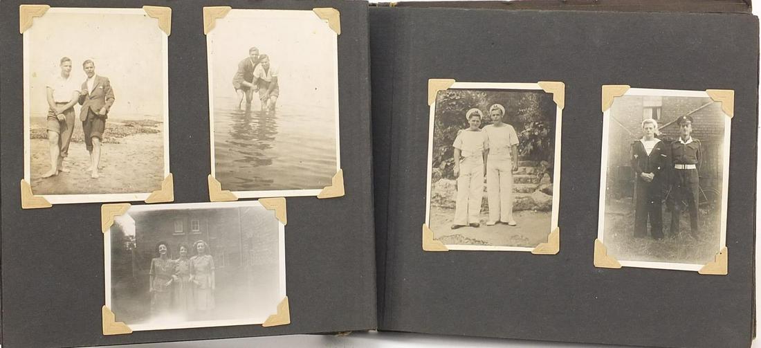 Military interest black and white photographs and: Military interest black and white photographs and postcards arranged in an album including The Manchester Regiment