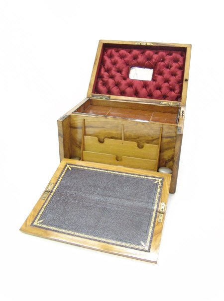 Victorian brass inlaid walnut writing box, the hin: Victorian brass inlaid walnut writing box, the hinged lid opening to reveal a mirrored and velvet lined interior above a lift out tray, the front opening to reveal a tooled leather writing slope, lett