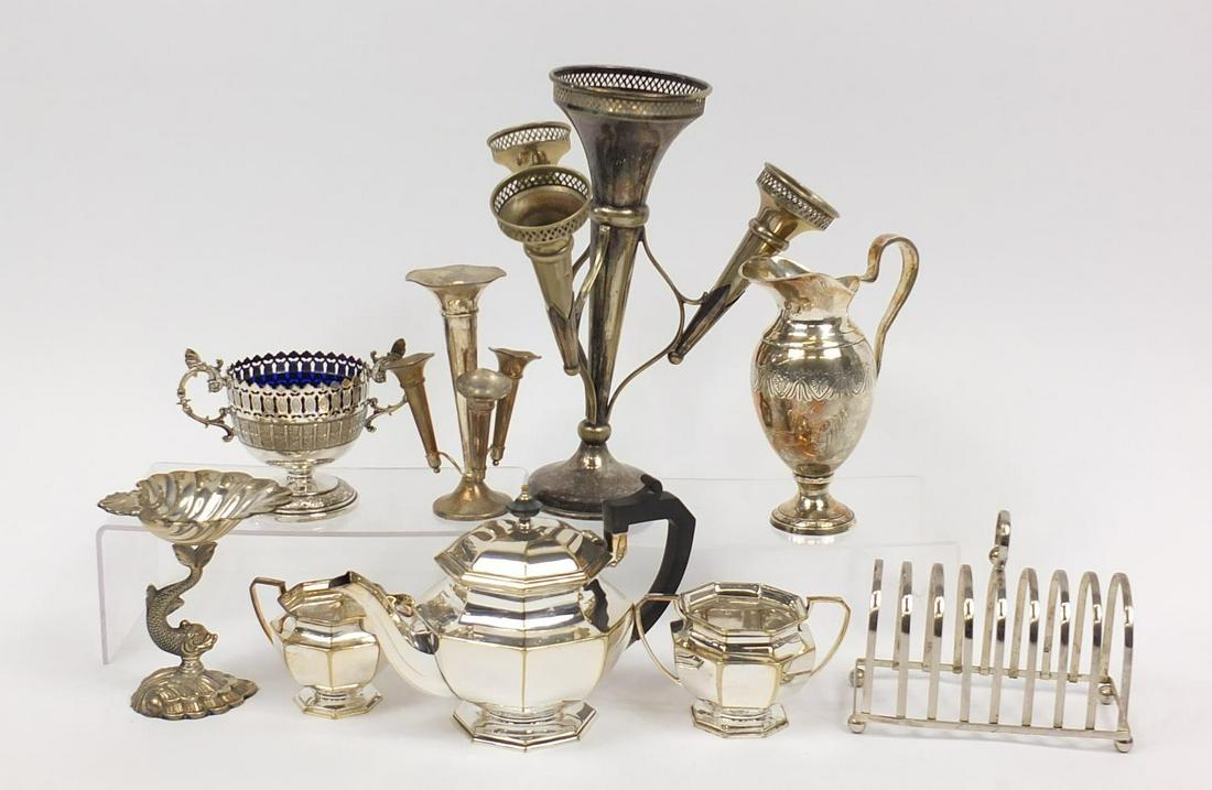 Silver plate including two four branch epergnes, three: Silver plate including two four branch epergnes, three piece tea service and toast rack, the largest 21.5cm high