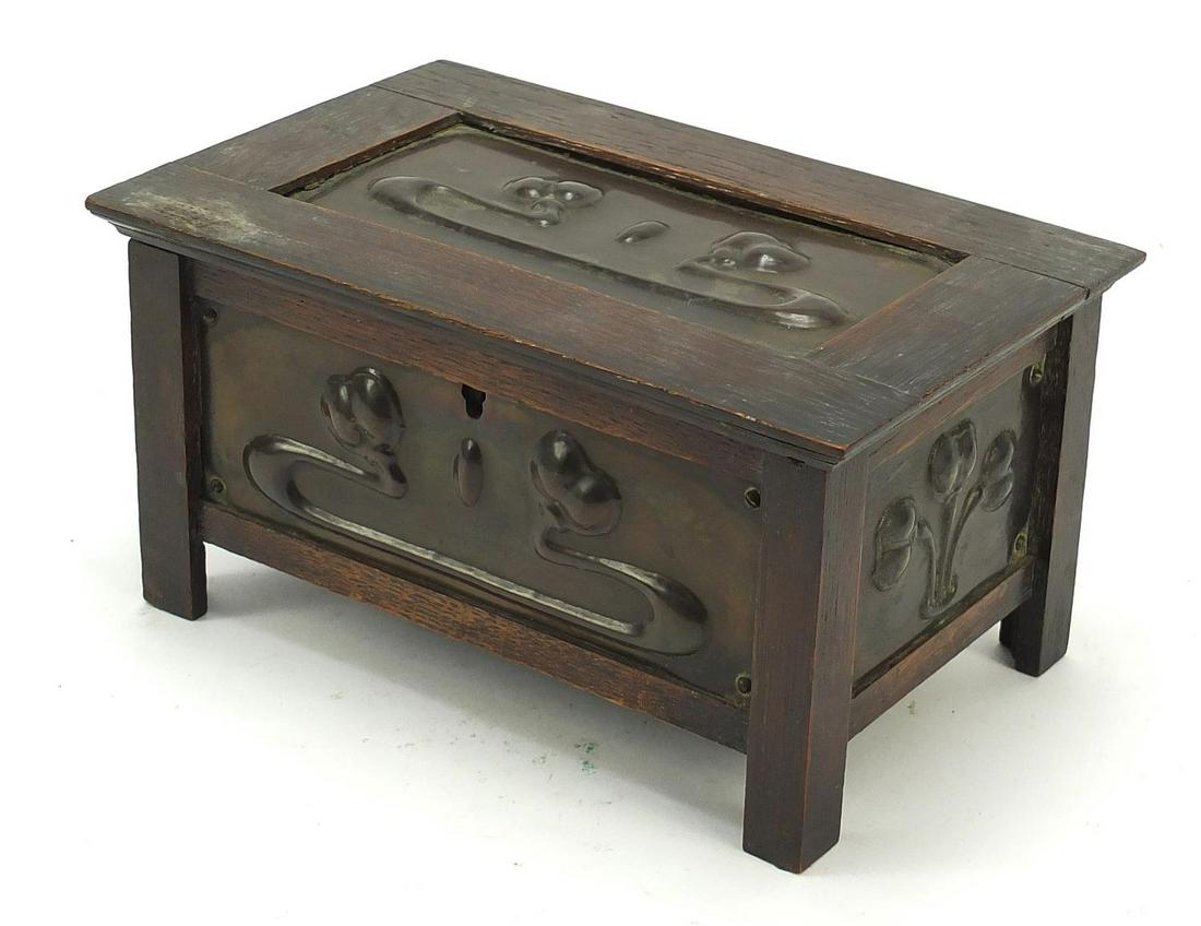 Arts & Craft oak casket with embossed copper panels in: Arts & Craft oak casket with embossed copper panels in the manner of John Pearson, 12cm H x 22.5cm W x 14.5cm D