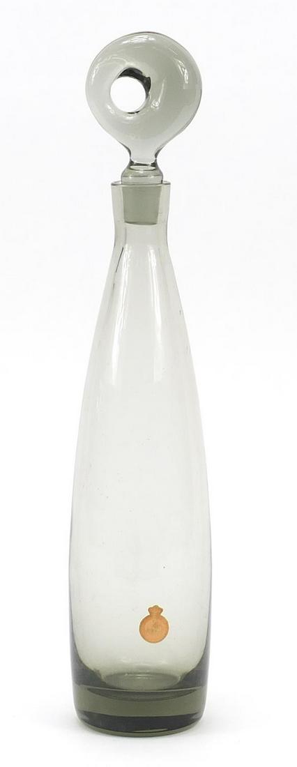 Per Lutken for Holmegaard, 1950's smoked glass: Per Lutken for Holmegaard, 1950's smoked glass Aristokrat decanter with paper label, 38cm high; Overall in generally good condition, there is one small minor flea bit chip around the base (inside) of