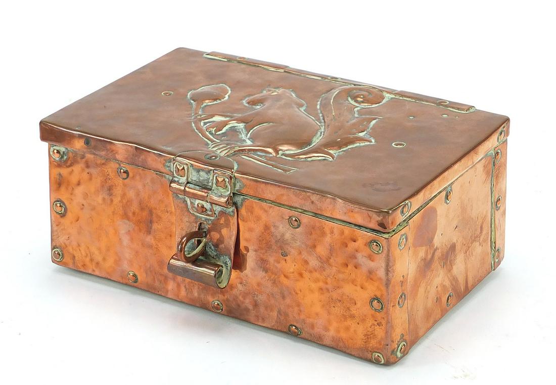 John Pearson, Arts & Crafts copper casket embossed with: John Pearson, Arts & Crafts copper casket embossed with a squirrel on an acorn tree, impressed JP to the reverse, 8cm H x 18cm W x 12cm D
