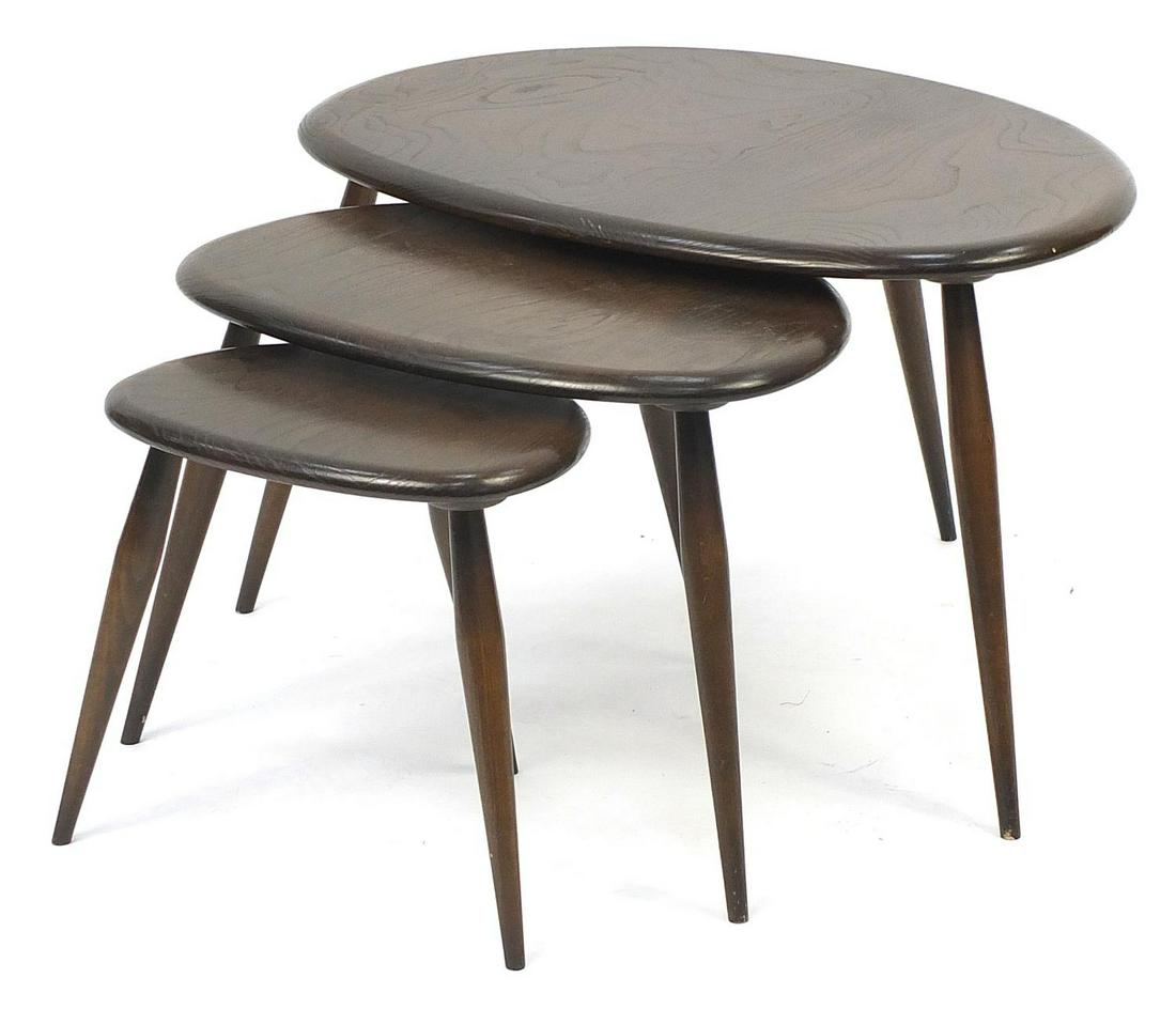 Nest of three Ercol elm Pebble occasional tables, the: Nest of three Ercol elm Pebble occasional tables, the largest 41cm H x 65cm W x 44cm D