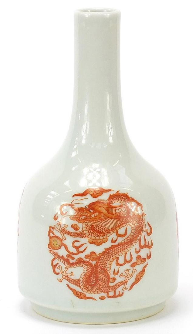 Chinese porcelain bottle vase hand paint...: Chinese porcelain bottle vase hand painted in iron red with three dragons chasing a flaming pearl amongst clouds, six figure character marks to the base, 15cm high