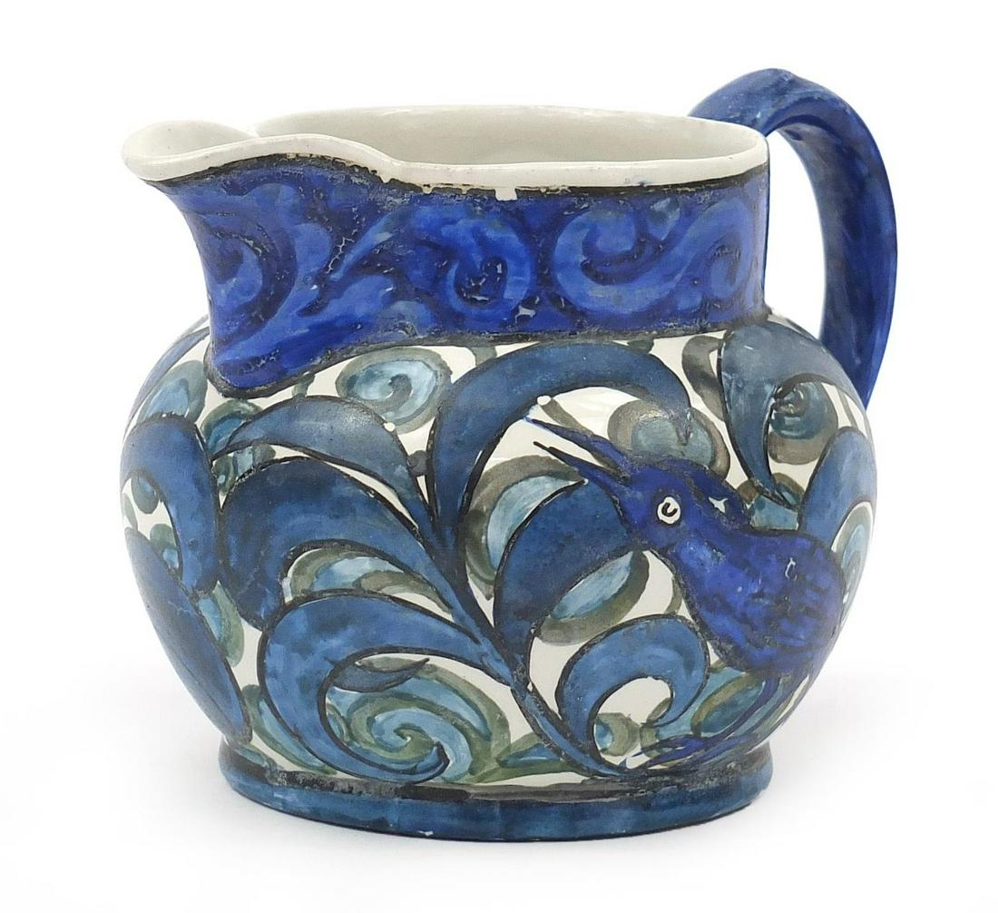John Pearson, Arts & Crafts pottery jug hand painted: John Pearson, Arts & Crafts pottery jug hand painted with a bird and flowers, 12cm high