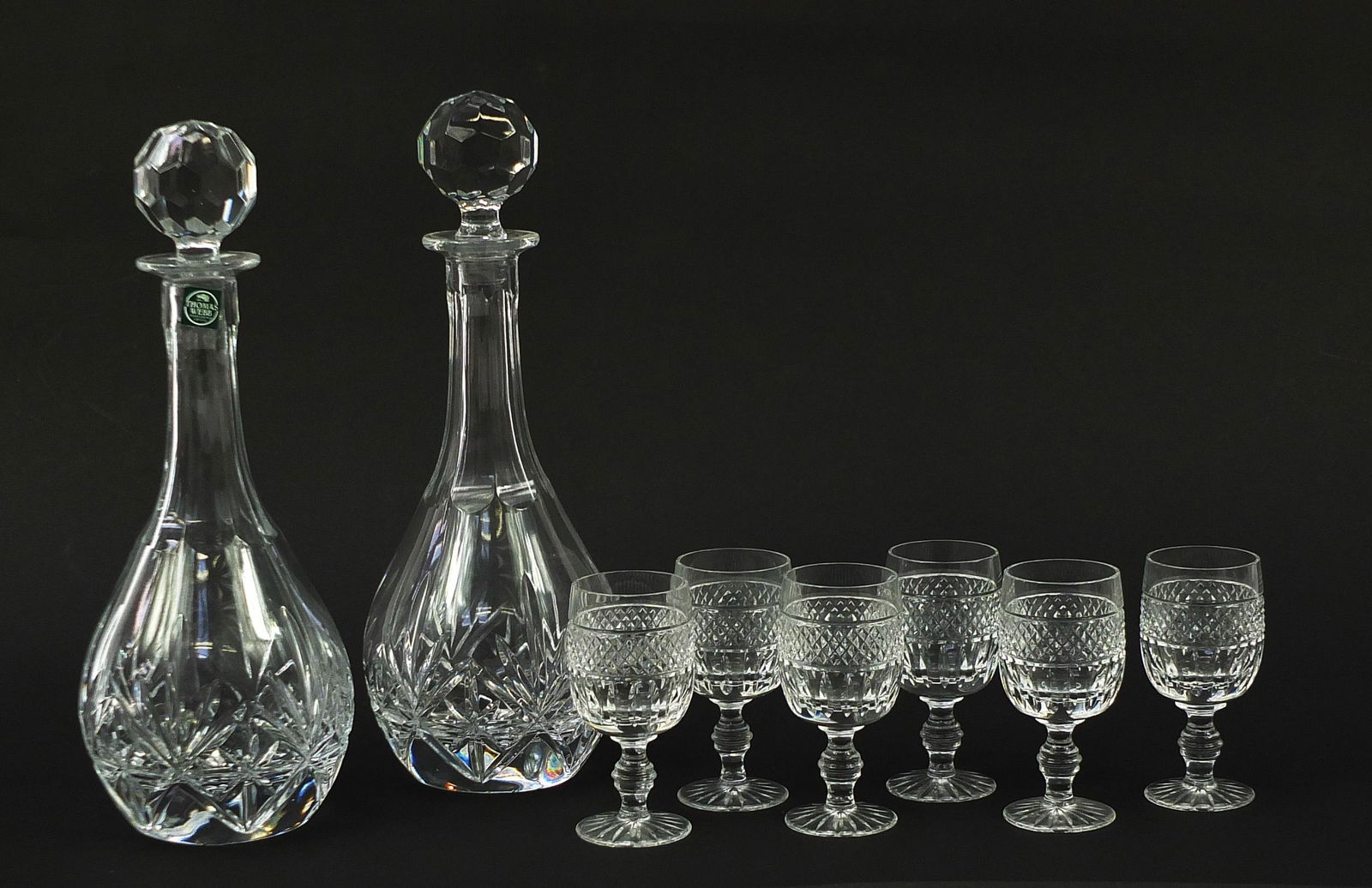 Pair of Thomas Webb cut glass decanters and six: Pair of Thomas Webb cut glass decanters and six glasses, the largest 32cm high