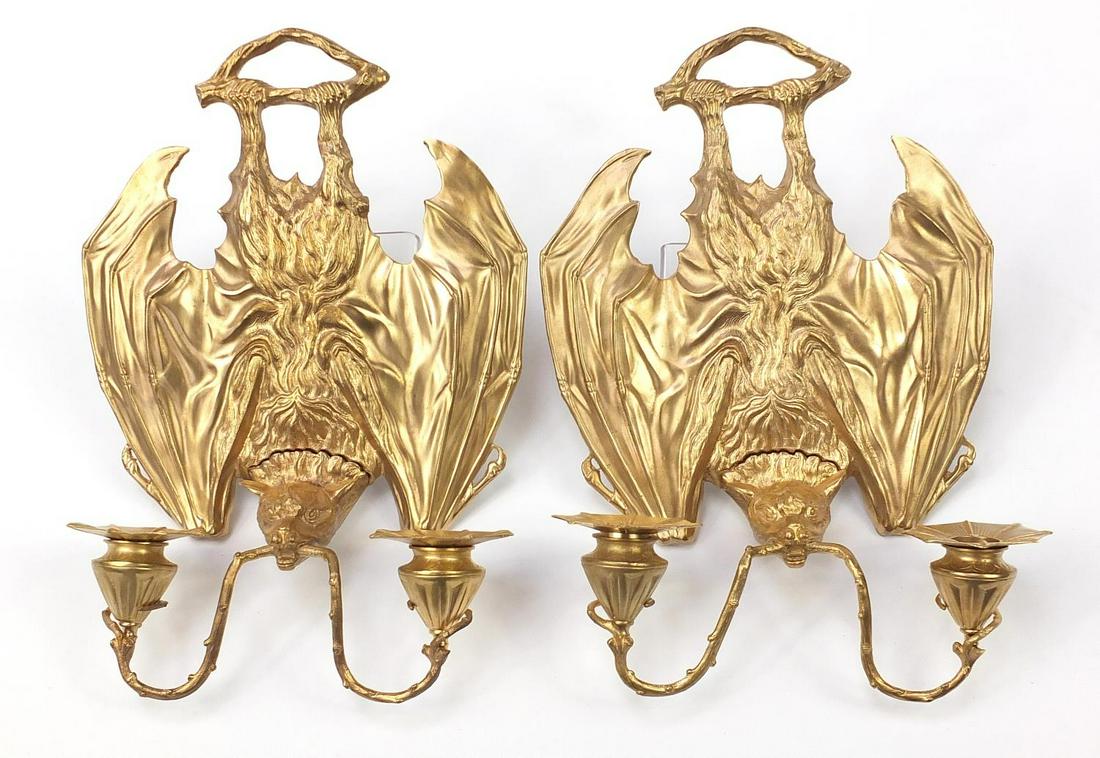 Pair of Art Nouveau style patinated bronze two branch: Pair of Art Nouveau style patinated bronze two branch bat design wall sconces, each 36cm high