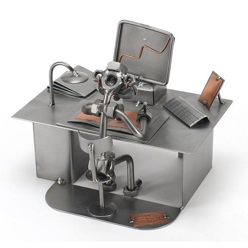 Kunst Design nut and bolt design sculpture of a figure: Kunst Design nut and bolt design sculpture of a figure at a computer desk, 17.5cm wide