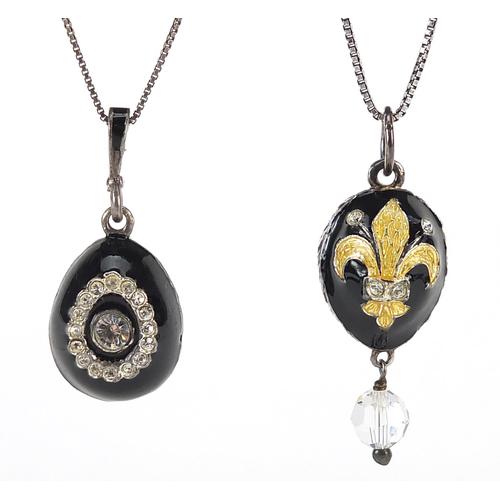 Two silver enamelled egg pendants on silver necklaces,: Two silver enamelled egg pendants on silver necklaces, the pendants 3cm high
