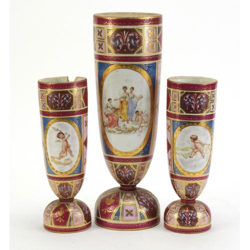 Garniture of three Austrian Vienna vases, each hand painted with foliage and decorated with panels: Garniture of three Austrian Vienna vases, each hand painted with foliage and decorated with panels of figures and Putti, the largest 34cm high