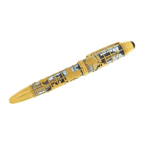 Montblanc, 18ct gold overlaid John Harrison 333 skeleton fountain pen with world map set with a: Montblanc, 18ct gold overlaid John Harrison 333 skeleton fountain pen with world map set with a diamond, limited edition 020/333, 14.5cm in length, 86.0g