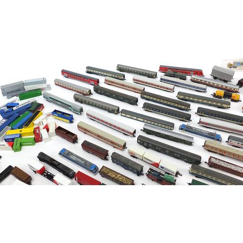 Large collection of N gauge model railway coaches, wagons and tankers